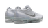 Close-up of Nike VaporMax 2023 Flyknit sneaker details in White/Sky Grey