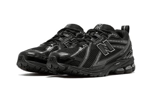 Close-up of New Balance 1906R sneaker details in Black Grey