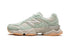 Limited-edition New Balance 9060 The Whitaker Group - Missing Pieces - Moss Green sneakers, available at ASEY SHOP Morocco.